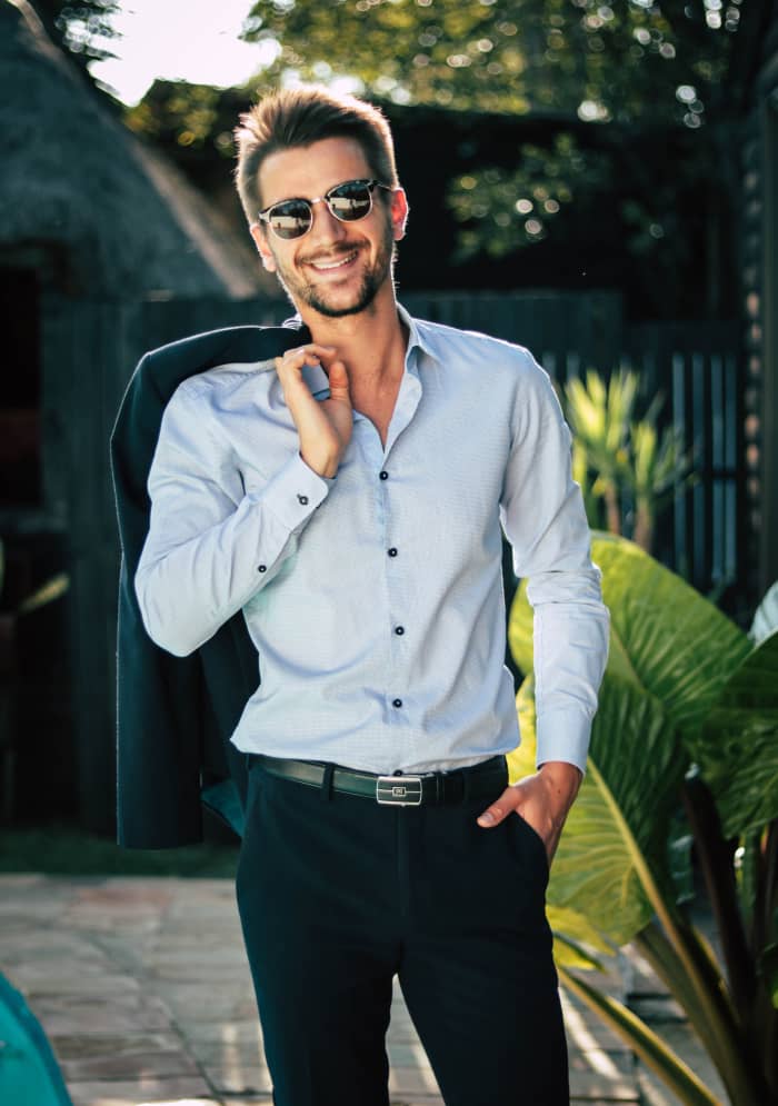 For men, a nice light blue button-up shirt, solid colors, and a silver buckle can give off a Cancer vibe.