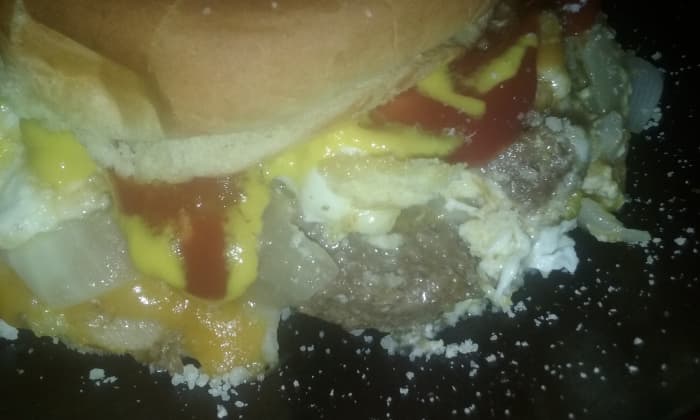 Messy but fantastic, here is a Bubba brand beef burger prepared with lots of toppings and a bun that could barely cover it all!