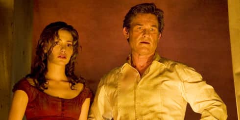 Jennifer Ramsey (Emmy Rossum) and her father Robert stare into the capsized ocean liner's lobby hoping to escape the fire