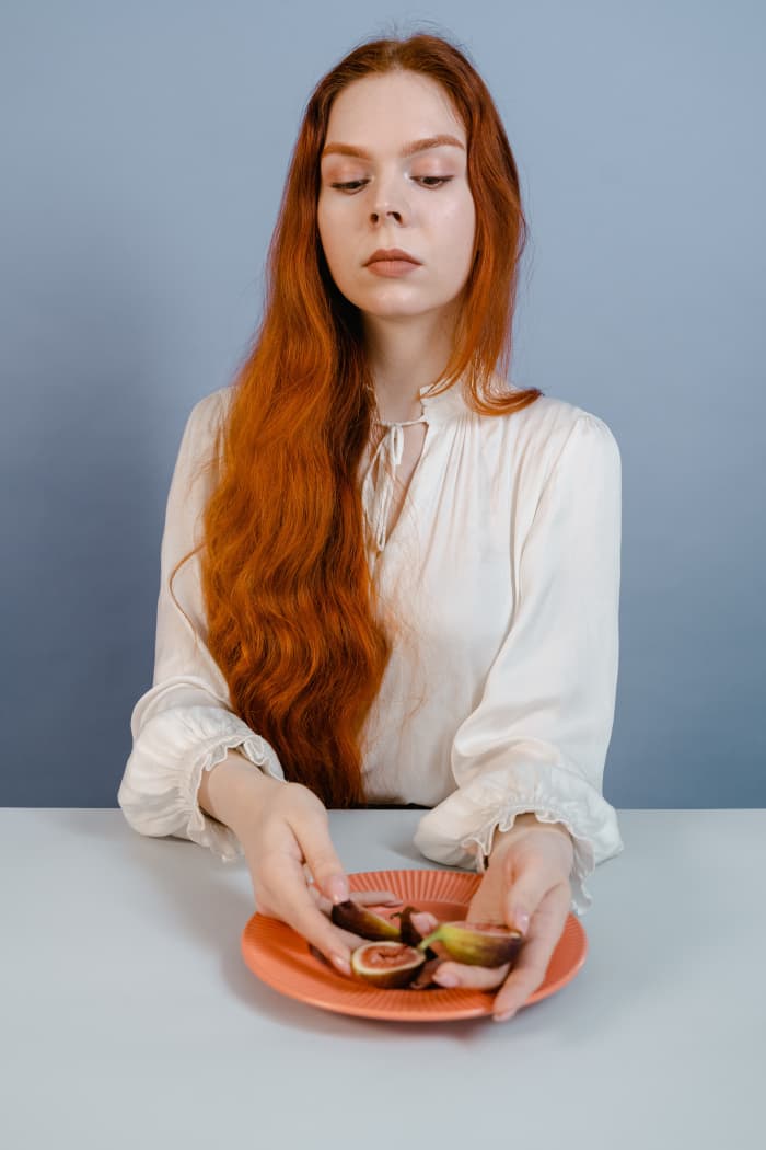Long locks in a bright color like red are very fire sign-like. Waves and curls remind me of Leos and their lion manes.