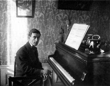 Maurice Ravel as a young man at the piano.