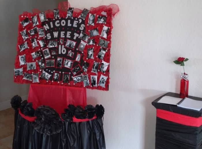I put the collage in the foyer on one of my easels and decorated it with tissue pouf balls from the dollar store. You can make these yourself too but why bother when you can get a strand of them for $1.00. I made the skirt with a tablecloth.
