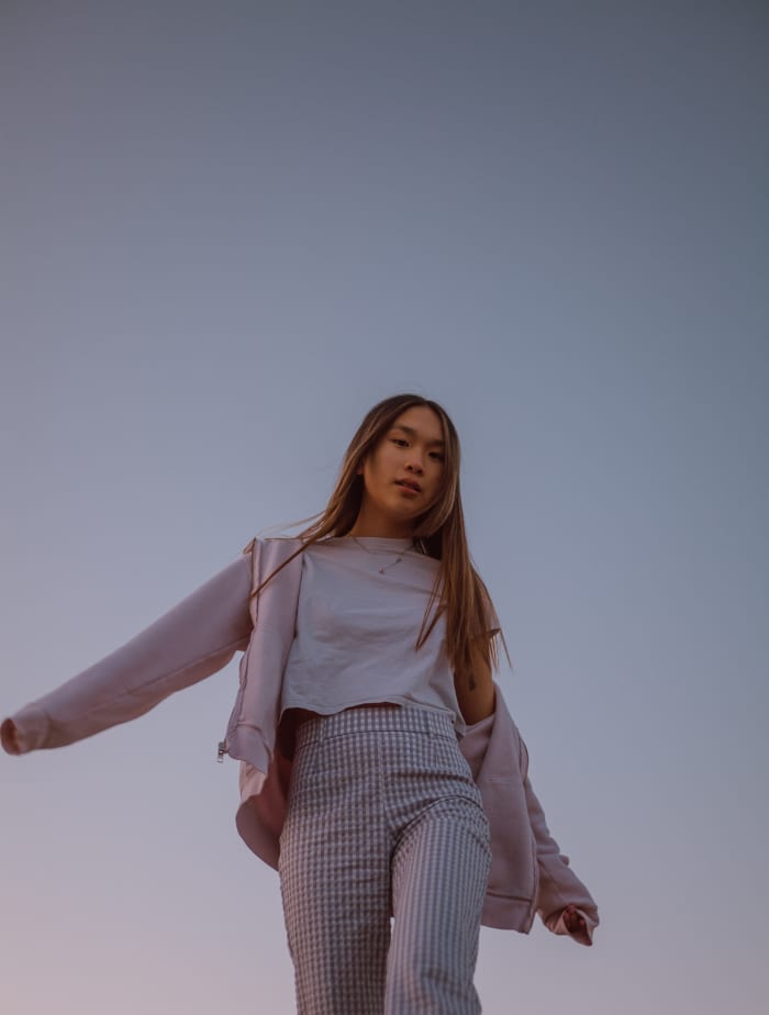 Libra clothing is about layers, covering up the collarbone, leaving some room for your hips and stomach, and wearing pink. A little bit of pattern adds whimsy.