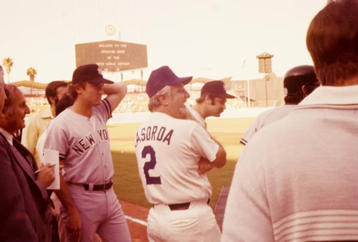 Craig Nettles and Tommy Lasorda meeting before Game 1. Thurman Munson and Bucky Dent can be seen up front.