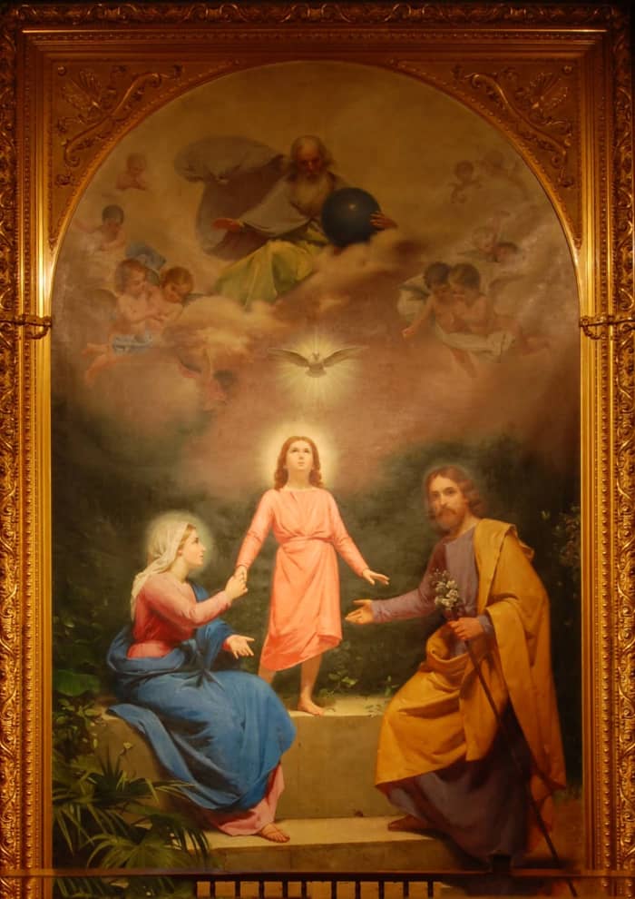 This painting shows the earthly trinity of Jesus, Mary, and Joseph, and the heavenly Trinity of the Father, Son, and Holy Spirit. Chapel of the Santa Clara Mission