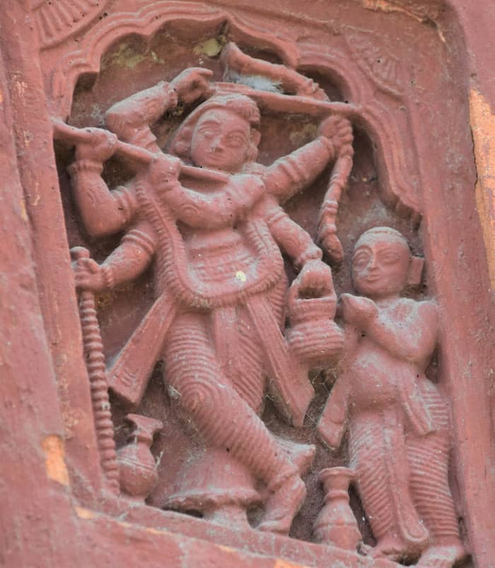 Shadbhuja Gauranga, terracotta; Shiva temple, Uchkaran, Birbhum. There is a single person accompanying Shadbbhuja Gauranga.