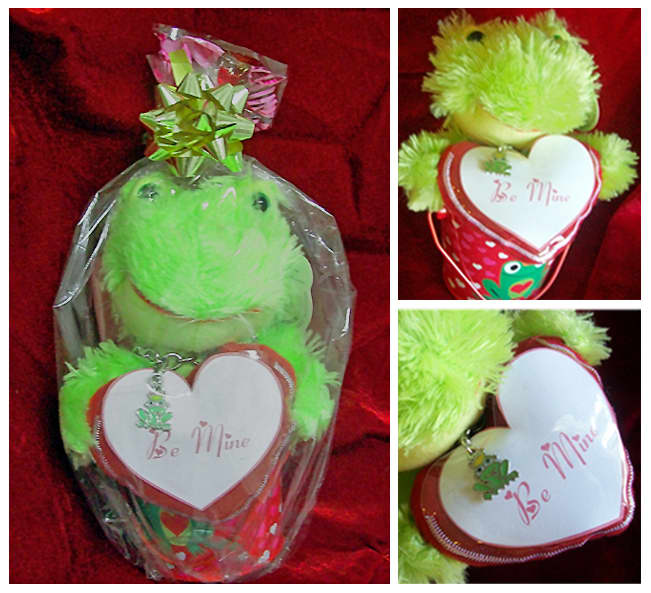 Small Valentine's Day bucket with stuffed froggy, a frog charm bracelet around his neck and a be mine gift tag.