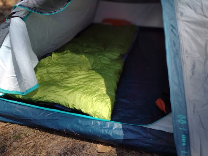 Fully assembled Quechua MH100 tent with sleep system. (Sleep system sold separately.)