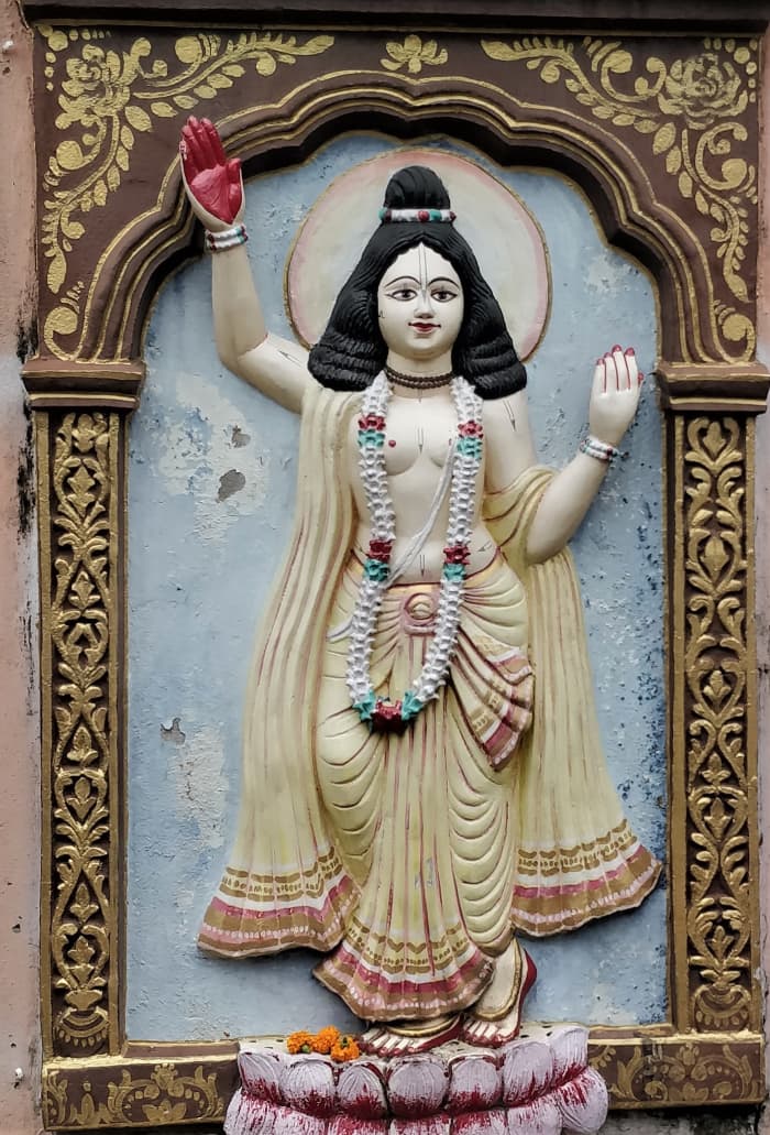 Shri Chaitanya Deva with his customary yellow/golden dress; stucco work. Shri Radhashyamsundarjiu temple, Khardah, North 24-Parganas.