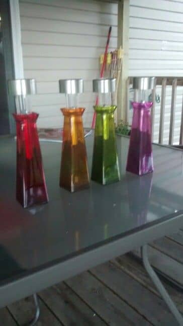 Easy, cheap solar lights for the deck, all from the Dollar Tree. One bottle, one solar light, and one craft bag of sand per light! Three bucks, and you have a great conversation!