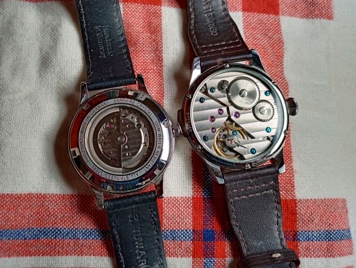 Two mechanical watches. The timepiece on the right is not an automatic and cannot be wound by the watch winder