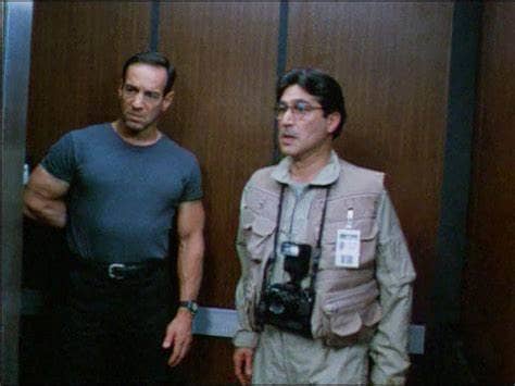 Daily Globe reporter Jake (Peter Onorati) is disgusted by what he's learned from former friend Stan (Chick Vennera)