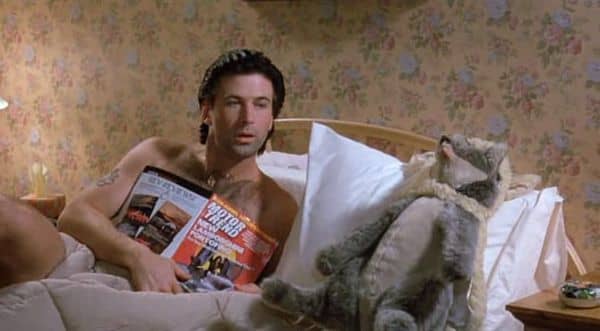Mick stops reading his magazine so that he can admire the birthday present that he bought his girlfriend, Tess.