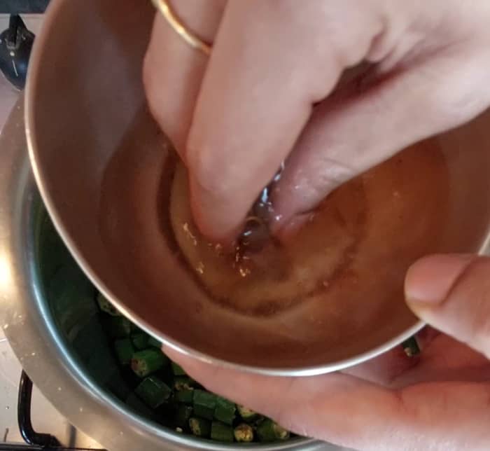 Add tamarind water (soak 1 teaspoon tamarind in hot water for 10 minutes, squeeze tamarind and add extract, discard the residue, or use tamarind paste).