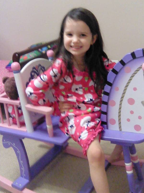 O' Sweet Child's favorite pink, purple and gold rocking horse that she received on her very first birthday from her "Nanny" and "Paw Paw" and that she still loves to this day, even more so than at age one! It has her name painted on the back rest.
