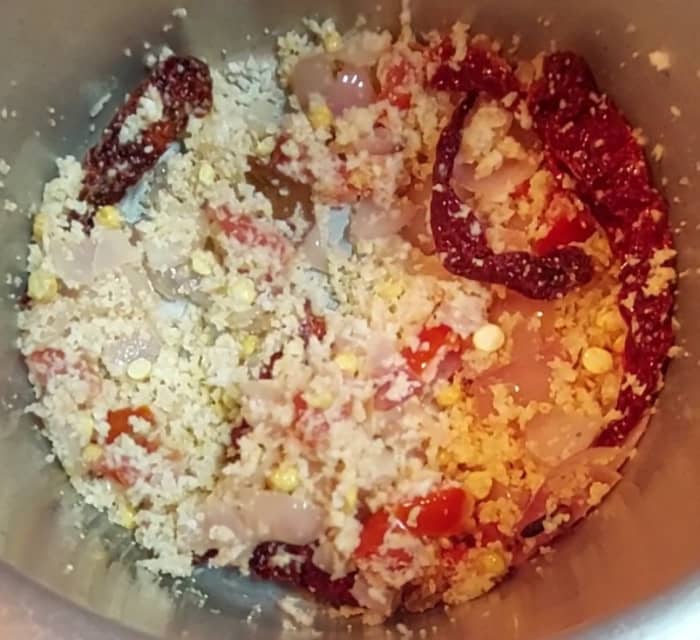 Add 1 cup grated fresh coconut, fry for a few seconds and switch off the flame. Let the mixture cool down.