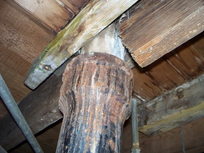This is a sewer pipe, but the lines going to the toilet are leaking. Here is a leak where the deposits are seen not only on the pipe, but also the wood.