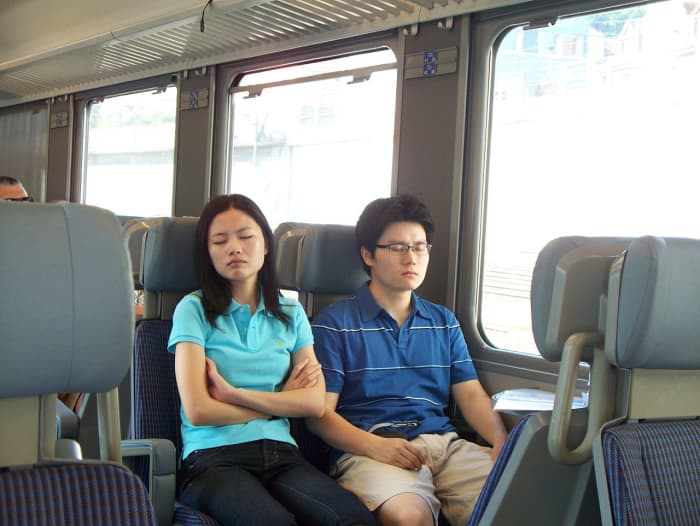 Couples sleeping in train