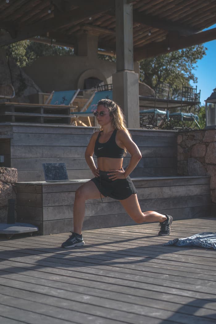 A side lunge, one of the many exercises you'll perform during P90X: Legs and Back. Go nice and low, but be mindful of your knees if you have patellar tracking problems!