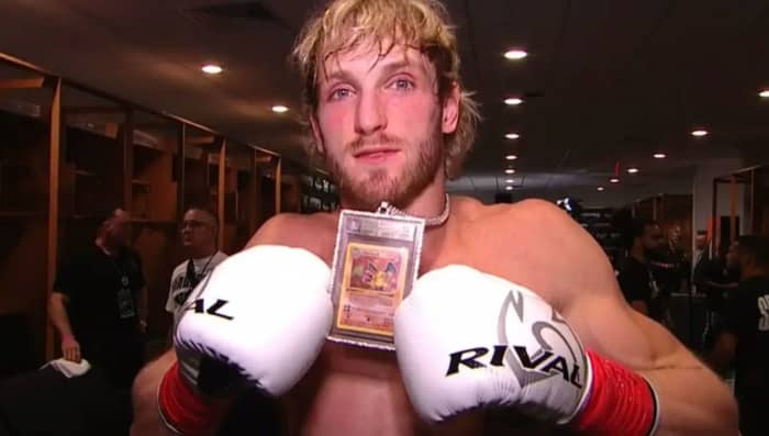 Logan Paul posing with a Beckett 10 1st Edition Charizard which he wears as a pendant on a chain. Paul has claimed that the necklace is worth around a million dollars, but only a fraction of that value can be attributed to the Charizard itself.