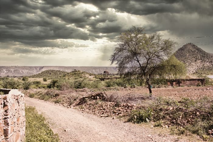 A landscape surrounding an abandoned cursed fort in a place named Ajabgarh on a way to the allegedly haunted place Bhangarh fort