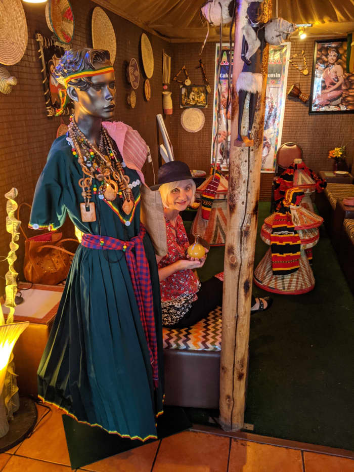 My wife seated in the room set up for traditional Ethiopian dining.