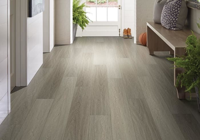 One of the moisture tolerant flooring options is luxury vinyl. Many of the lines are totally water resistant.