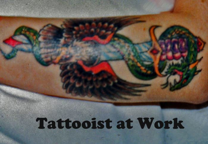 This is my friend's tattoo after Lal Hardy , a popular London tattoo artist, started work covering up his old tattoos
