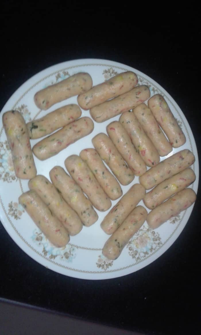 Grease your palms with some oil and grease the plate on which you will place the rolls. Now take a small portion of dough and form a roll.