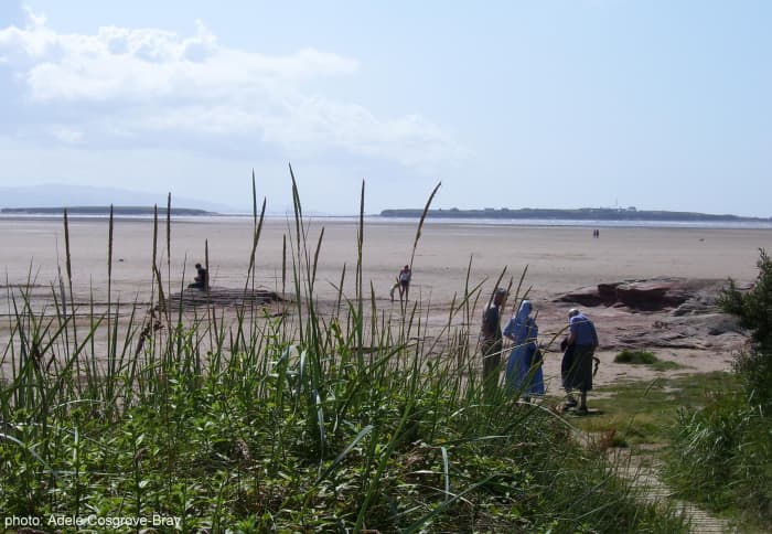 Emerging from the boardwalk, you arrive at a red sandstone outcrop. On the horizon are Middle Eye and Hilbre Islands. If you walk along the adjacent Stanley Road you'll find a good choice of bars and restaurants in Hoylake.
