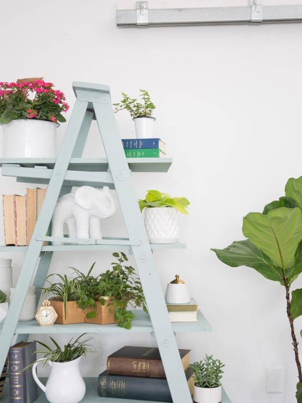 Make a statement storage item for your home by transforming an old wooden ladder. Fill it with books, trees, framed pictures, or something else you'd like to show.