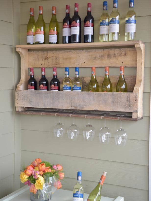 Transform an ordinary wooden pallet into a rustic outdoor wine rack that can accommodate at least several bottles of wine as well as stemware.