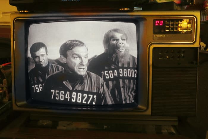 Don West and Doctor Smith look completely miserable on the Prison Planet, but Creech, played by Michael Conrad seems to not care.