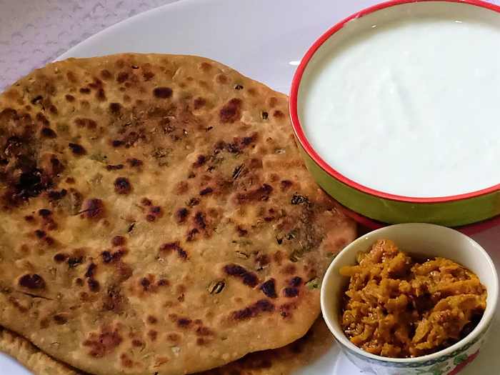 Mooli ka paratha is prepared with stuffed radish leaves