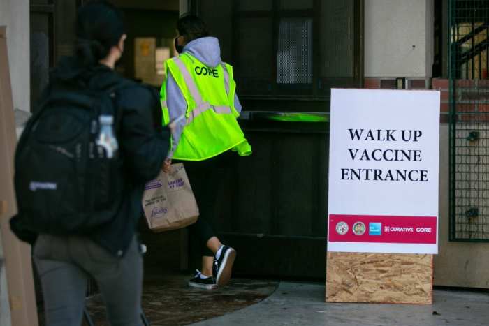 Individuals show up this week at another immunization site at USC intended to make portions accessible to hard-hit networks and those without a car.