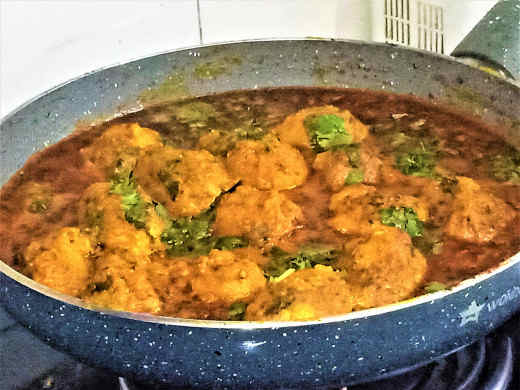 Dum arbi (taro root curry) prepared in the dhaba style