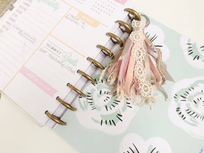 You can use those bits of ribbon that you may have to create this keychain. I would also consider using it in a planner, or in a journal.