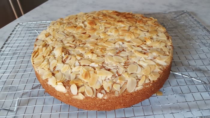 Brown butter almond cake cooling on rack