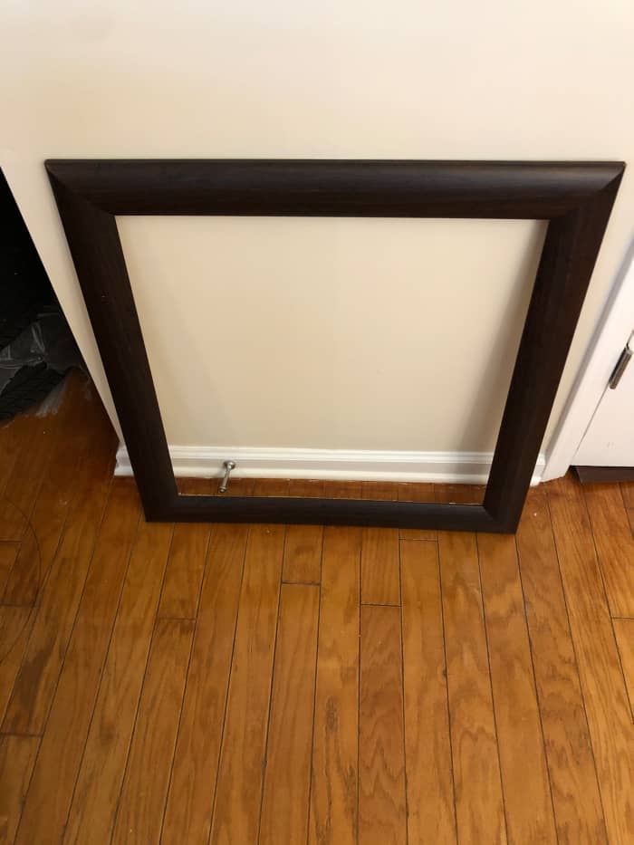 Here’s the frame of the art in question. This is cheap, cheap plastic with a wood look that wouldn’t fool a five-year-old.