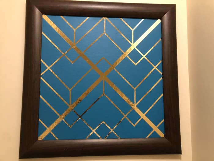 I originally was going to do something to the frame, maybe spray paint it, but since the art was so loud I think the plain frame works.