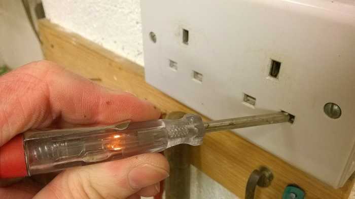 A phase tester screwdriver can also be used for testing for the presence of power. The blade tip must contact the live electrical conductor and you must touch the metal pad on the end of the handle of the screwdriver to earth it.