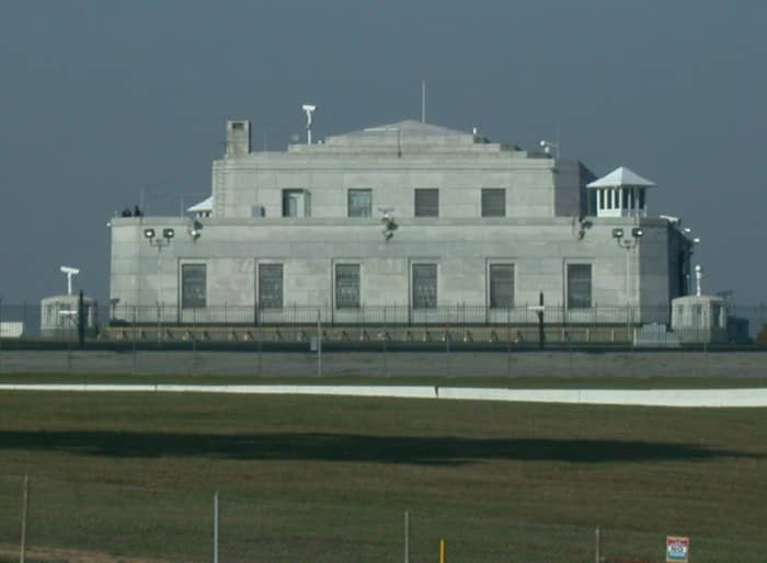 The United States Bullion Depository in Kentucky. Notice the cameras, wire fences, and guard towers.
