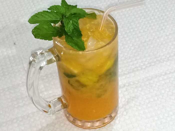 Refreshing mojito mocktail prepared with mandarin oranges
