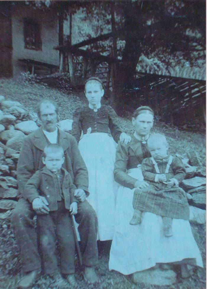Paternal Grandma at age of about 13 in Austria. Pictured with her father, stepmother, and half-brother and half-sister. Picture taken around 1890.