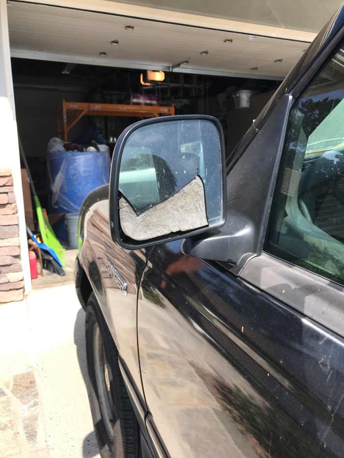 A broken driver-side mirror.