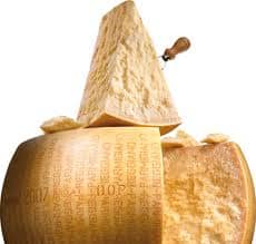 One cheese wheel of Parmigiano Reggiano that has been cut to use, just look at the texture you almost can taste it, yum!