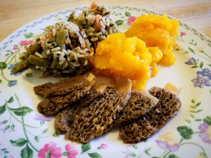 Halved Morel mushrooms, fried in salted butter and garlic, served with Hubbard squash and veggie rice.