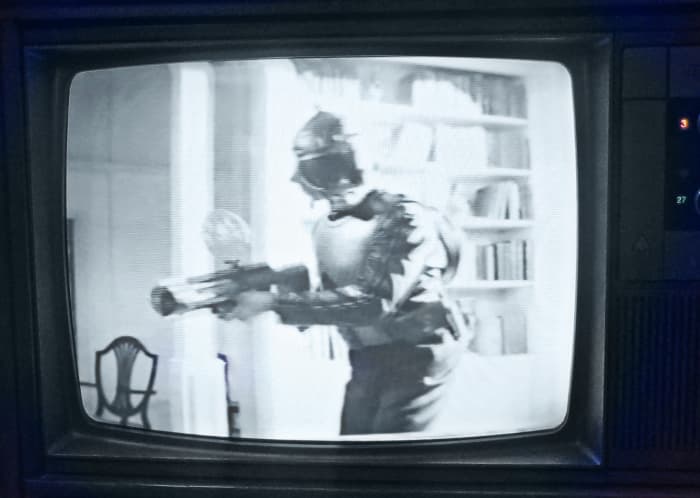A quirk in Time lands an Earth soldier of the future back in our present time. Government authorities apprehend and hold him in custody for examination. This television is one of the early Quasar Dynacolor designs, Chassis Number SLTS976FA03.