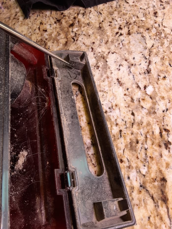 As you can see, we have pet hair in our home and our Roomba gets a workout. The sensor in the bin is located at the end of the pointer in the upper right hand corner of the photo.