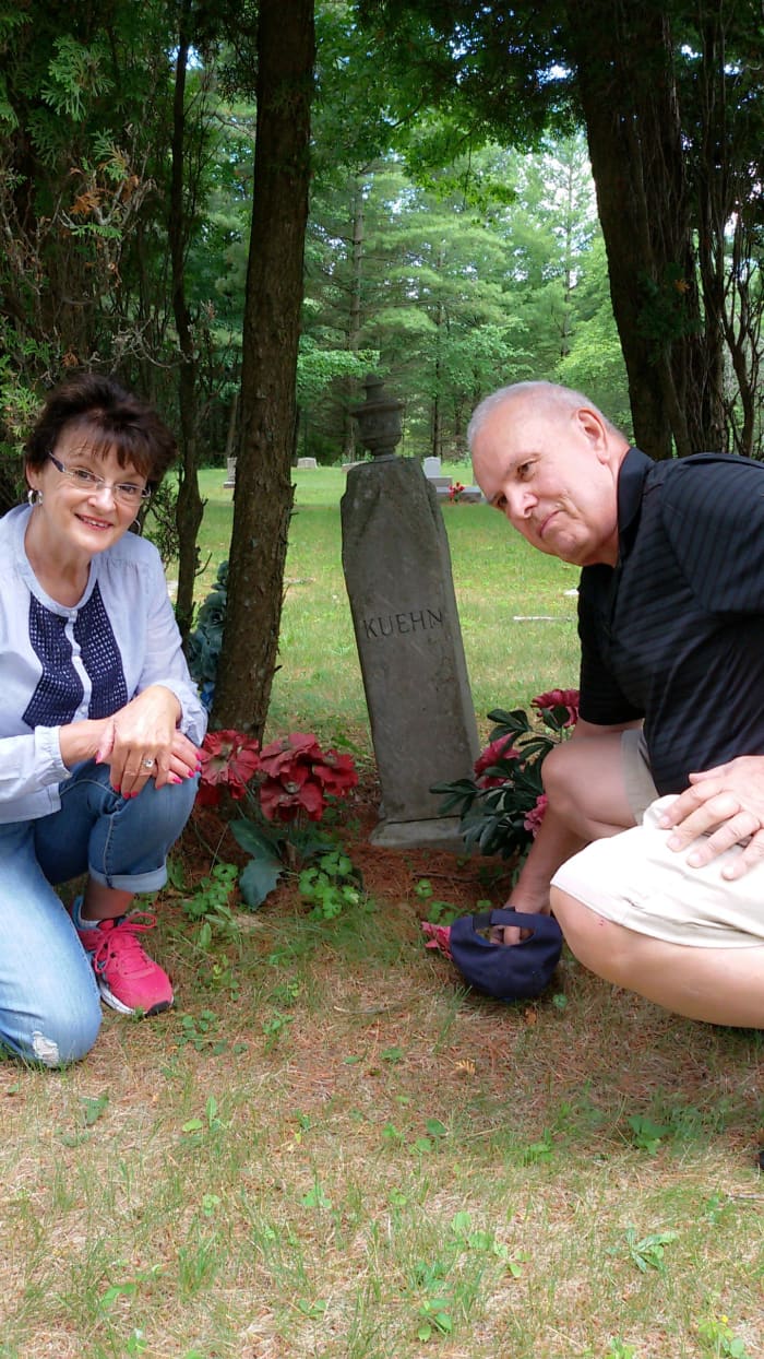 Grave of our great-grandfather, Carl August Kuehn. Author is pictured with his second-cousin Margie Kuehn Nelson.